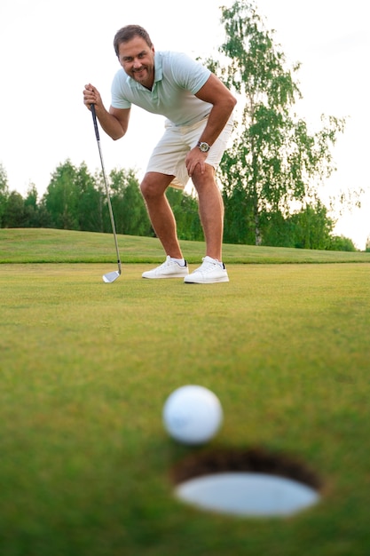 Free photo scene with man on the golf course