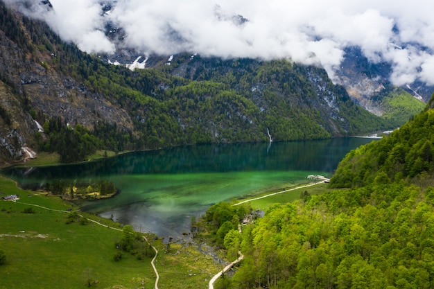 Free Photo scenic mountain panorama with green meadows and idyllic turquoise