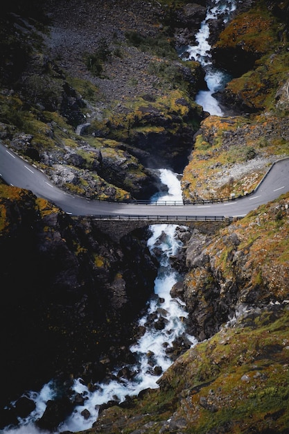 Free Photo scenic view of a beautiful bridge over a rocky river in the countryside