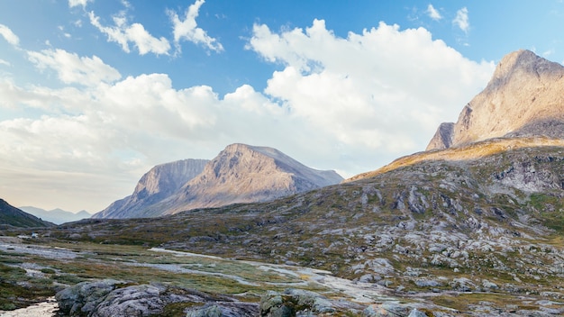 Scenic view of rocky mountain landscape with blue sky and cloud