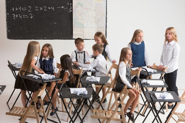 School children in classroom at lesson