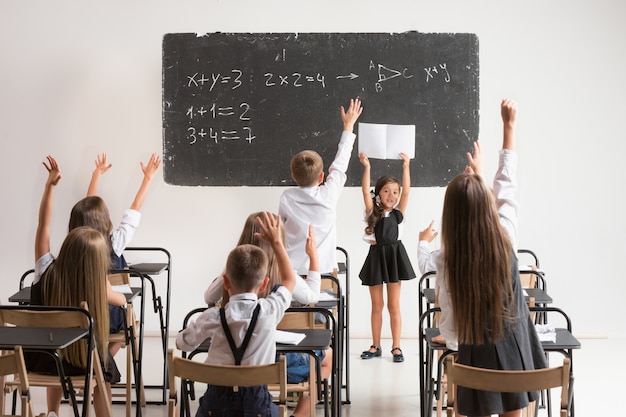 Free photo school children in classroom at lesson