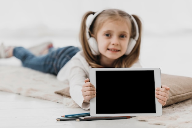 School girl wearing headphones virtual school