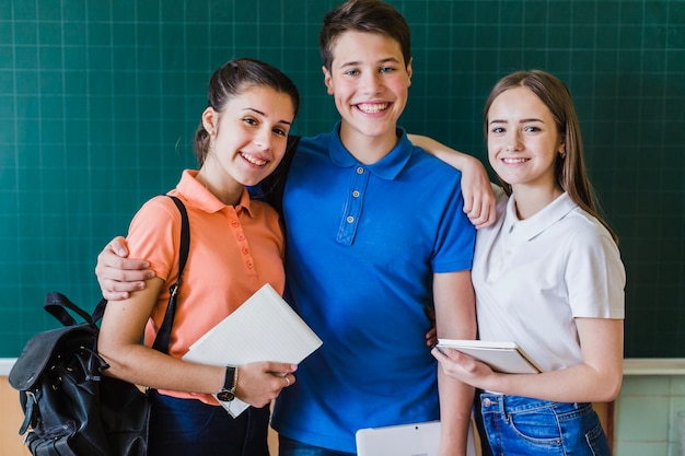 School partners posing with the blackboard