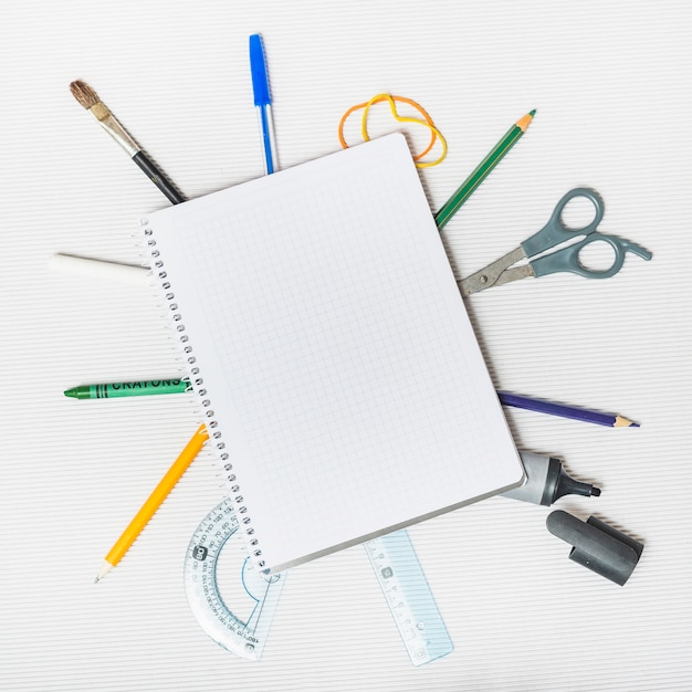 Free photo school supplies around notepad