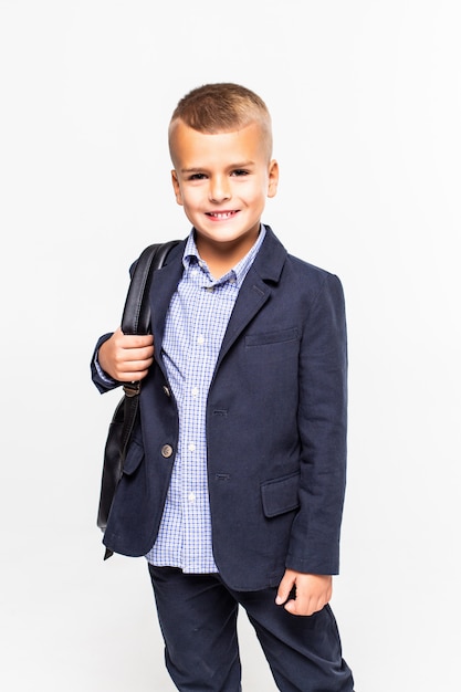 Free Photo schoolboy with bag isolated on a white wall