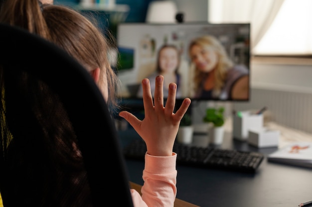 Free Photo schoolchild greeting remote friends discussing school leeson