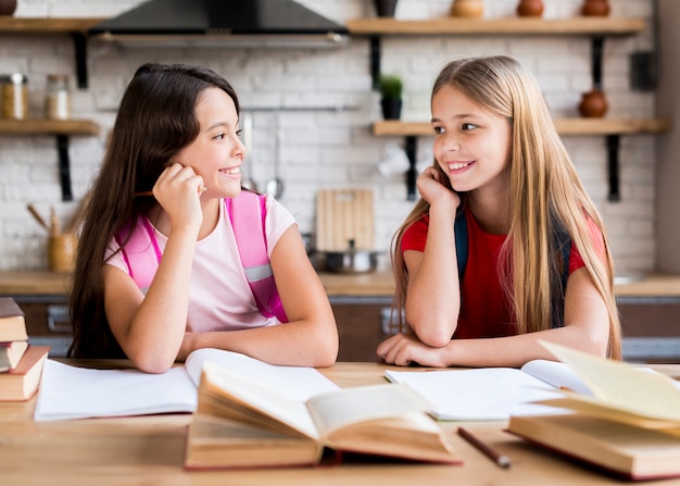 Schoolgirls doing homework together