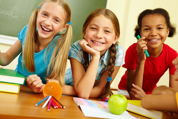 Schoolgirls laughing in class