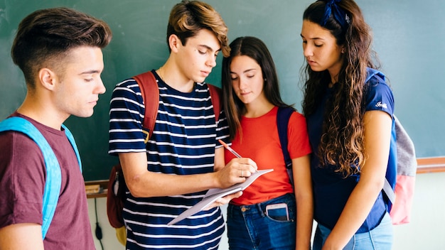 Schoolkids writing something down