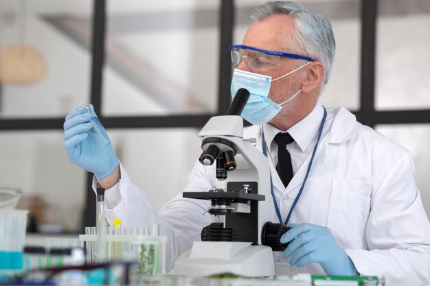 Scientist wearing protection equipment medium shot