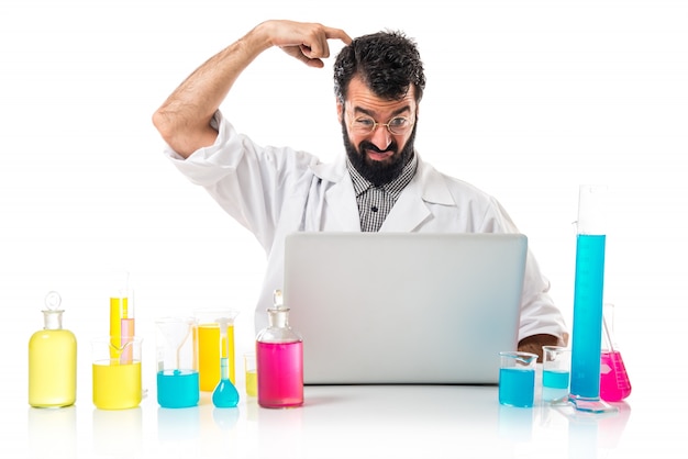 Scientist with his laptop thinking