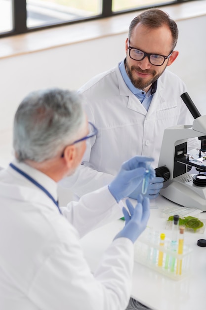 Scientist working with microscope