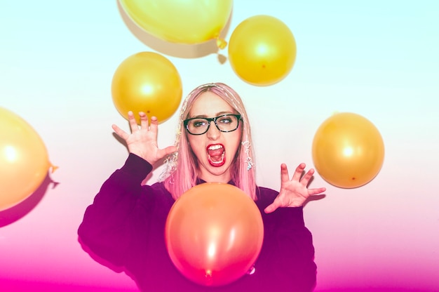 Screaming party girl with globes