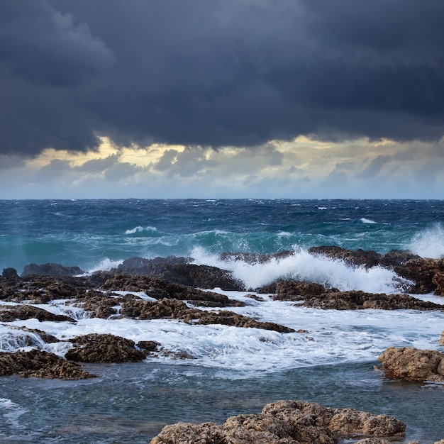 Sea wave breaking against coast  rock