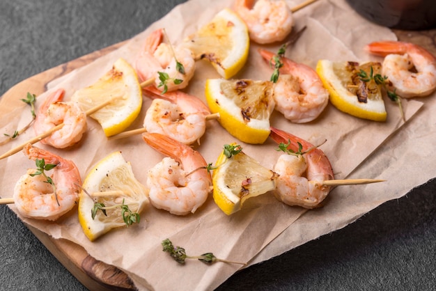 Seafood shrimp skewers on baking paper high view