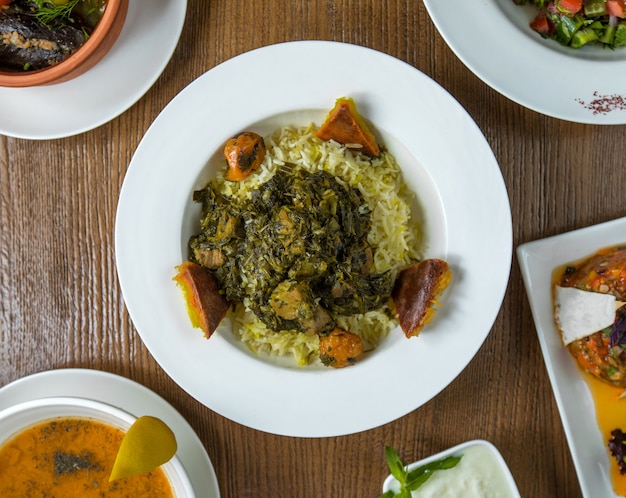 Sebzi govurma plov with beef stew with herbs.