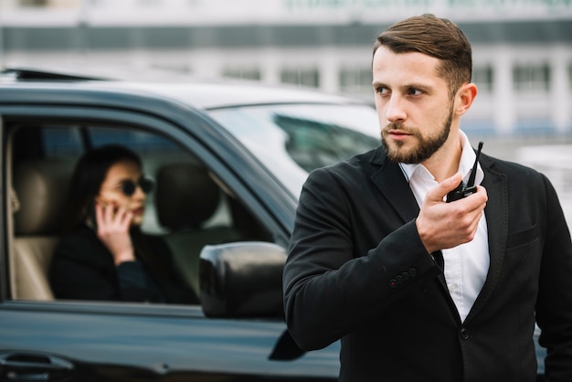 Security guard protecting client