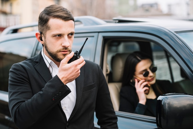 Free photo security man protecting client