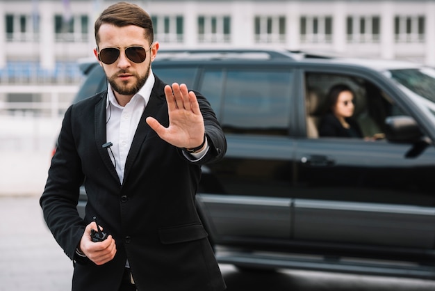 Security man stopping photographers