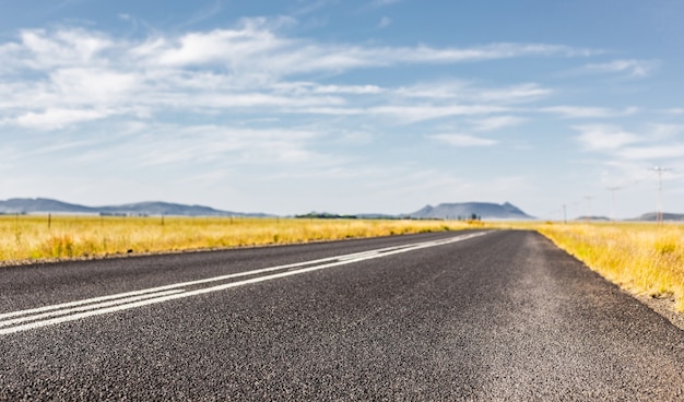 Selective focus shot of an asphalt road in a rural area