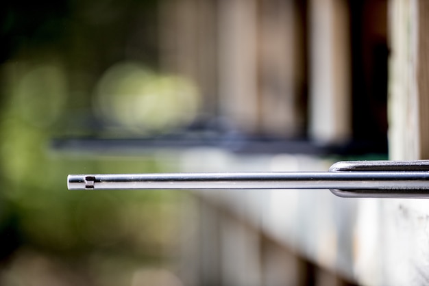 Selective focus shot of a rifle at the gun range