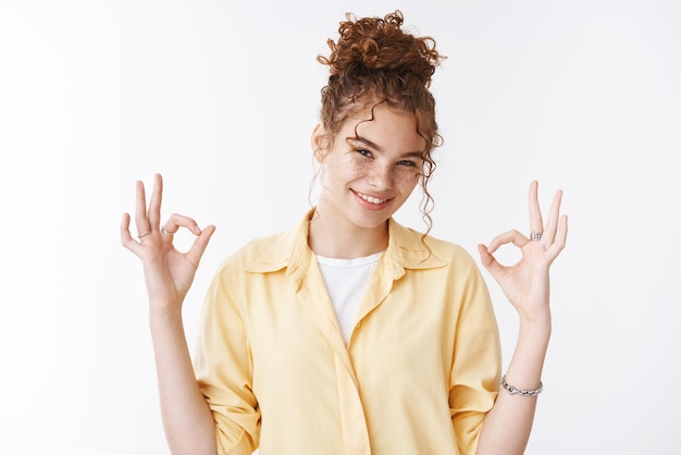 Self-assured charismatic positive  female show okay  gesture