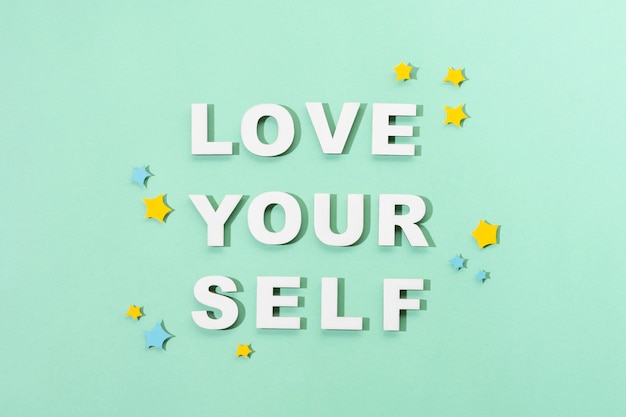 Free photo self love lettering in paper style arrangement