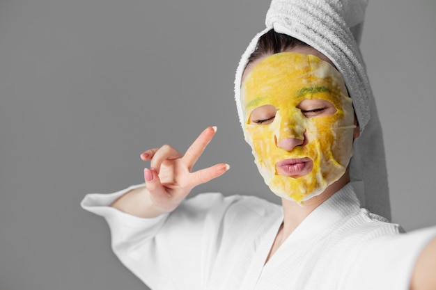 Free photo selfcare concept woman with facemask close up