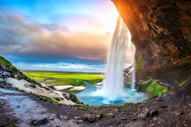 Free Photo seljalandsfoss waterfall during the sunset, beautiful waterfall in iceland.