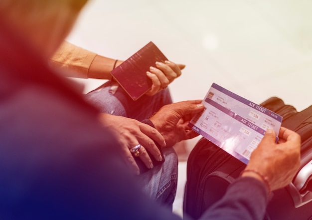 Senior adult couple with boarding pass at the  airport