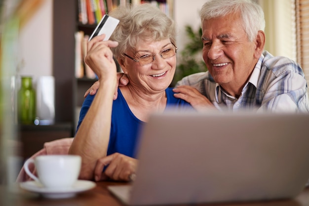 Senior couple browsing Internet without any problems