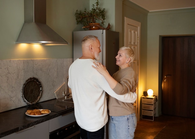 Senior couple dancing at home