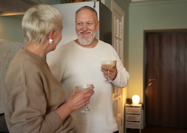 Senior couple dancing at home