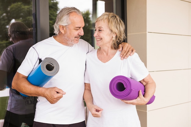 Free Photo senior couple excising in garden