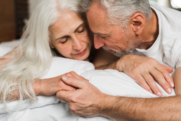 Senior couple holding hands