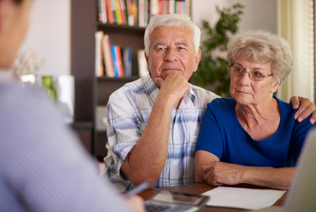 Senior couple paying a visit at accountant
