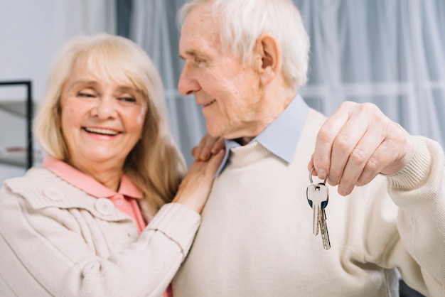 Senior couple with keys