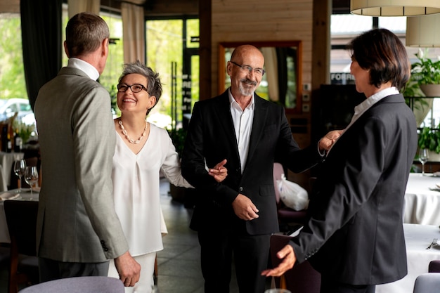 Free photo senior couples together at a luxurious restaurant