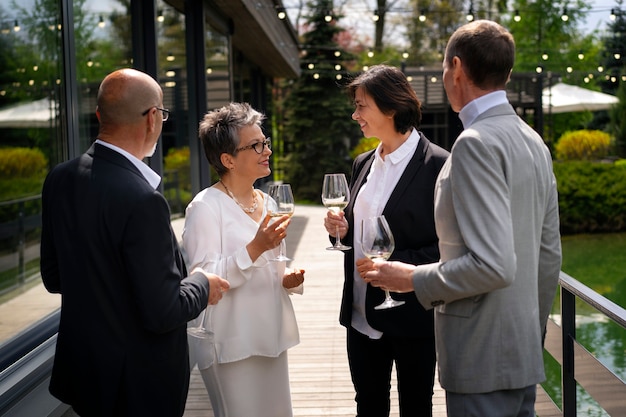 Free Photo senior couples together at a luxurious restaurant