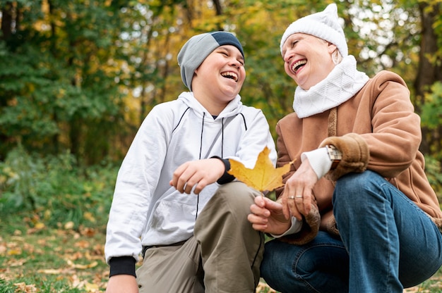 Senior female with grandson in park