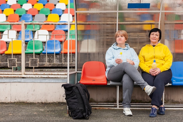 Senior females on stadium resting