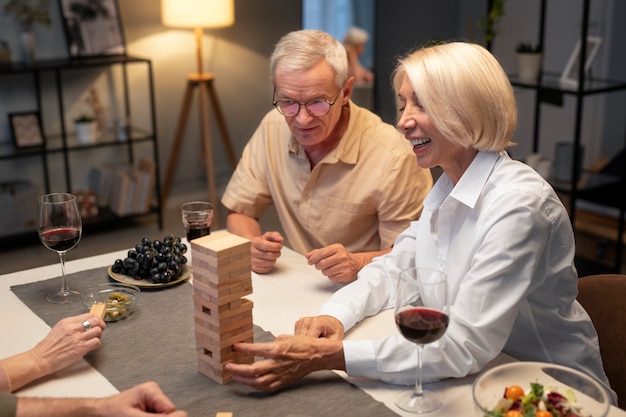 Senior friends having a party at night