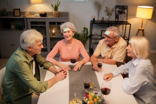 Senior friends having a party at night