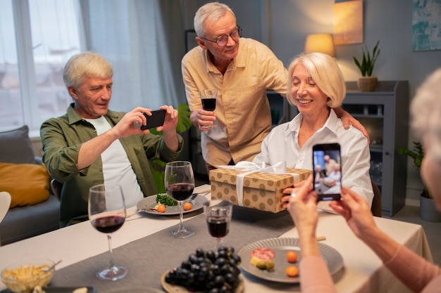 Senior friends having a party at night