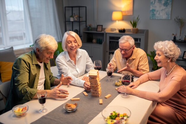 Senior friends having a party at night