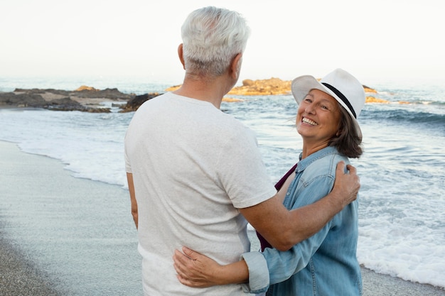 Senior loving couple spending time together at the beach