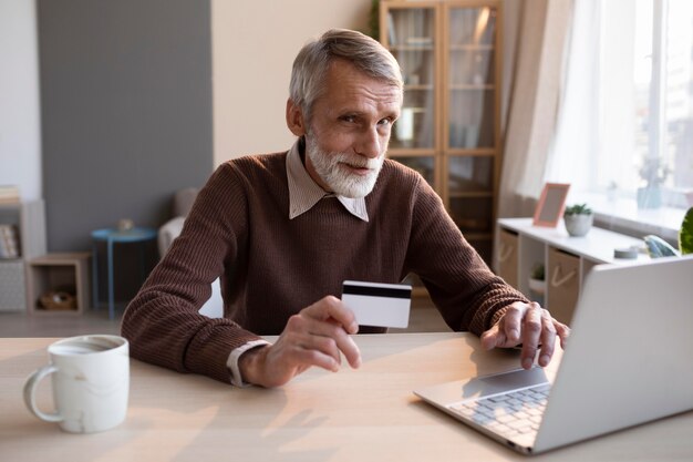 Senior male ready to shop online