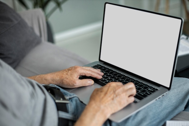 Senior man doing online classes on a laptop