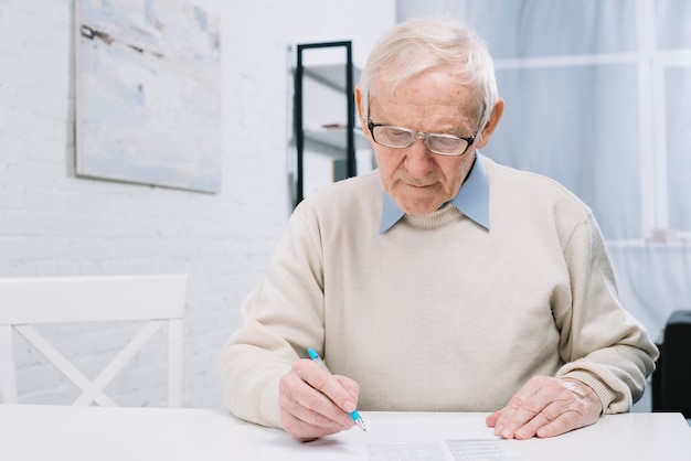 Senior man doing paperwork